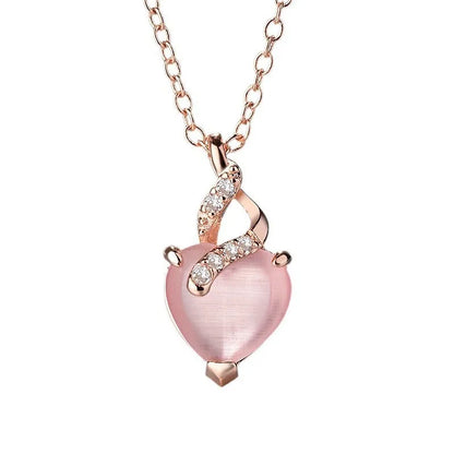Women's rose gold heart-shaped pendant necklace with pink crystal centre on cross chain