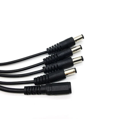 Black DC monitoring power splitter cable with four output connectors for security camera systems