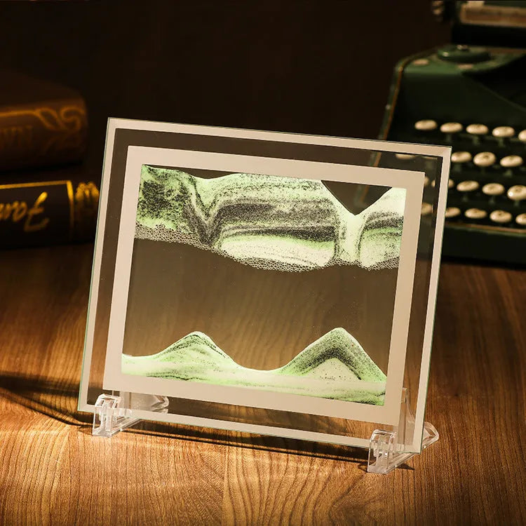 Geometric glass ornament containing a colourful quicksand landscape painting in modern style.