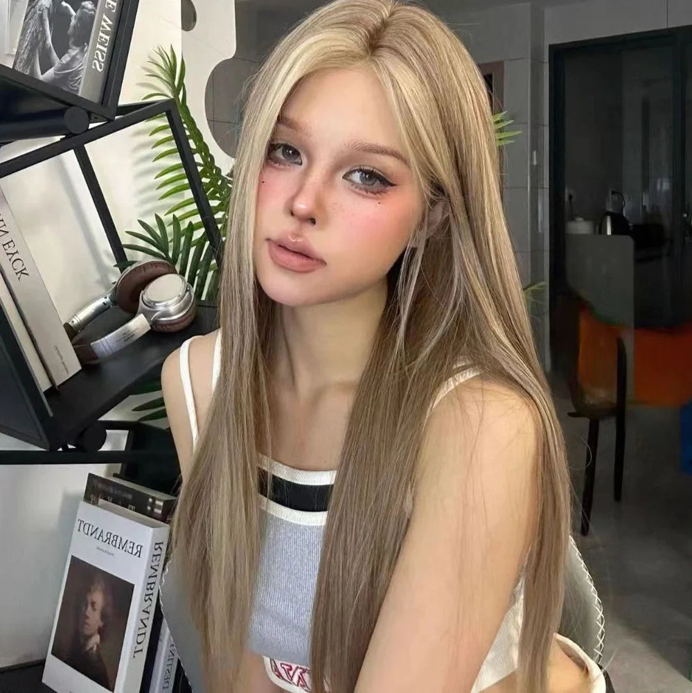 Forehead lace wig with golden brown gradient colour and centre-parted style on display