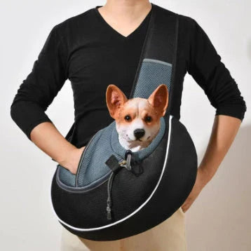 A stylish and secure crossbody carrier bag designed for transporting pets comfortably and safely