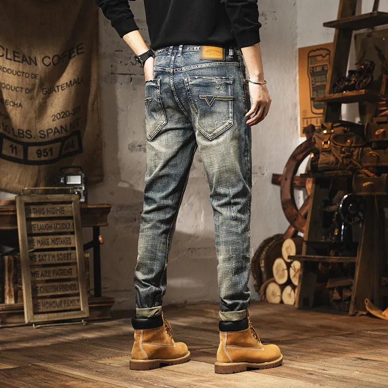 Men's vintage blue straight-leg jeans with a fleece lining and drawstring waist closure.