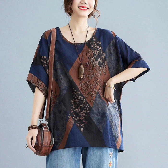 Stylish women's retro-inspired t-shirt in vibrant yellow, red, and brown printed design