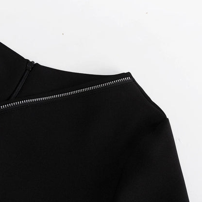 Elegant crossbody dress with zipper detail, high-waisted silhouette, and long sleeves in a solid black colour