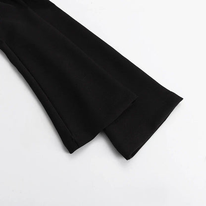 Elegant crossbody dress with zipper detail, high-waisted silhouette, and long sleeves in a solid black colour