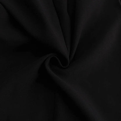Elegant crossbody dress with zipper detail, high-waisted silhouette, and long sleeves in a solid black colour