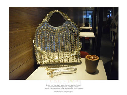 Fashionable diamond-studded messenger bag with shimmering PU leather surface, versatile carrying options, and practical organisational features