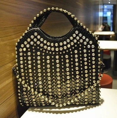 Fashionable diamond-studded messenger bag with shimmering PU leather surface, versatile carrying options, and practical organisational features