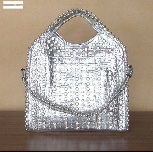 Fashionable diamond-studded messenger bag with shimmering PU leather surface, versatile carrying options, and practical organisational features