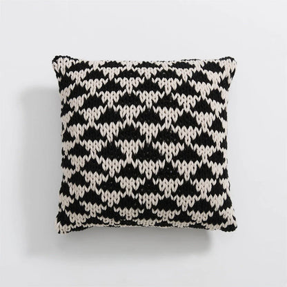 A luxurious hand-crocheted throw pillow with a chunky knit design, providing cosy comfort and elegant style for your home decor.
