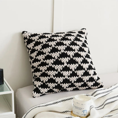 A luxurious hand-crocheted throw pillow with a chunky knit design, providing cosy comfort and elegant style for your home decor.
