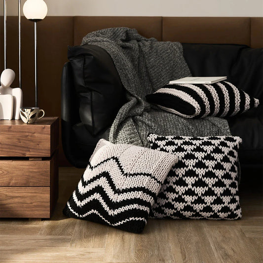 A luxurious hand-crocheted throw pillow with a chunky knit design, providing cosy comfort and elegant style for your home decor.