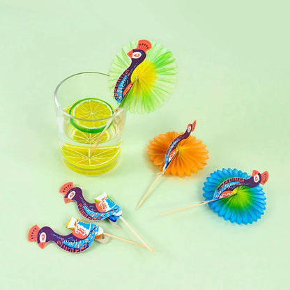 Colourful paper umbrella cake toppers in various patterns, including cartoon animals, flowers, and food items.