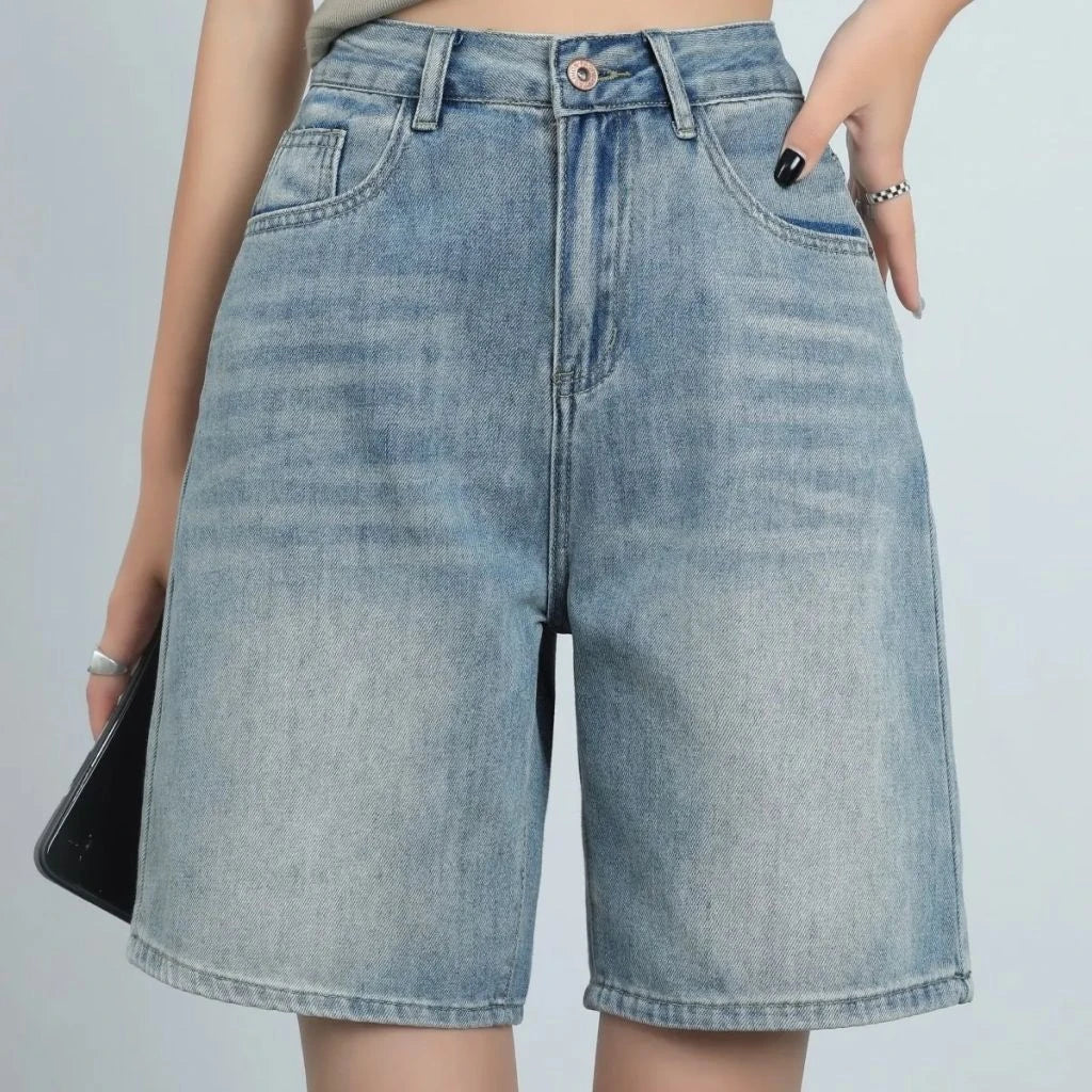 High-waist knee-length denim shorts for women, featuring a flattering silhouette and versatile casual style.