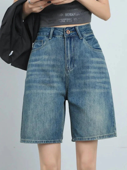 High-waist knee-length denim shorts for women, featuring a flattering silhouette and versatile casual style.