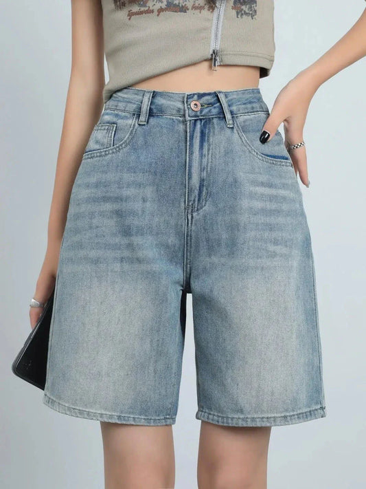 High-waist knee-length denim shorts for women, featuring a flattering silhouette and versatile casual style.