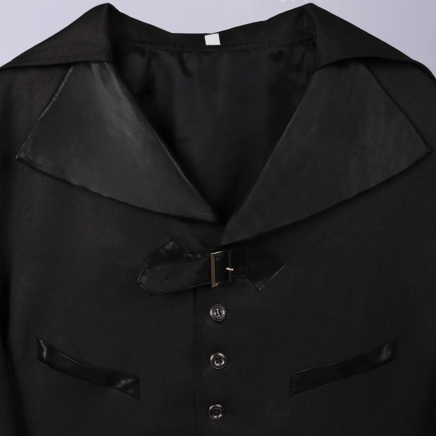 A model wearing a green Halloween-themed dovetail punk gothic coat with a sophisticated, edgy design