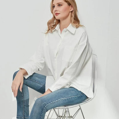 Elegant vintage-inspired blue oversize blouse with a sophisticated turn-down collar and full-length sleeves