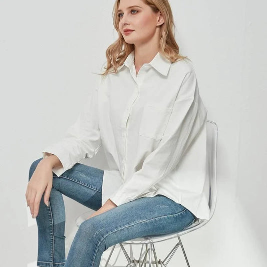 Elegant vintage-inspired blue oversize blouse with a sophisticated turn-down collar and full-length sleeves