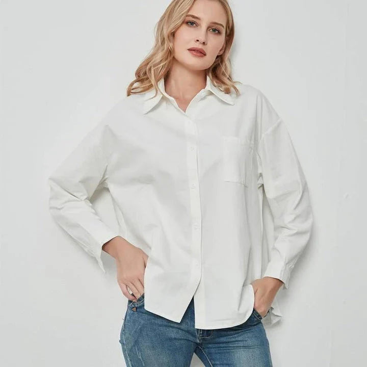 Elegant vintage-inspired blue oversize blouse with a sophisticated turn-down collar and full-length sleeves