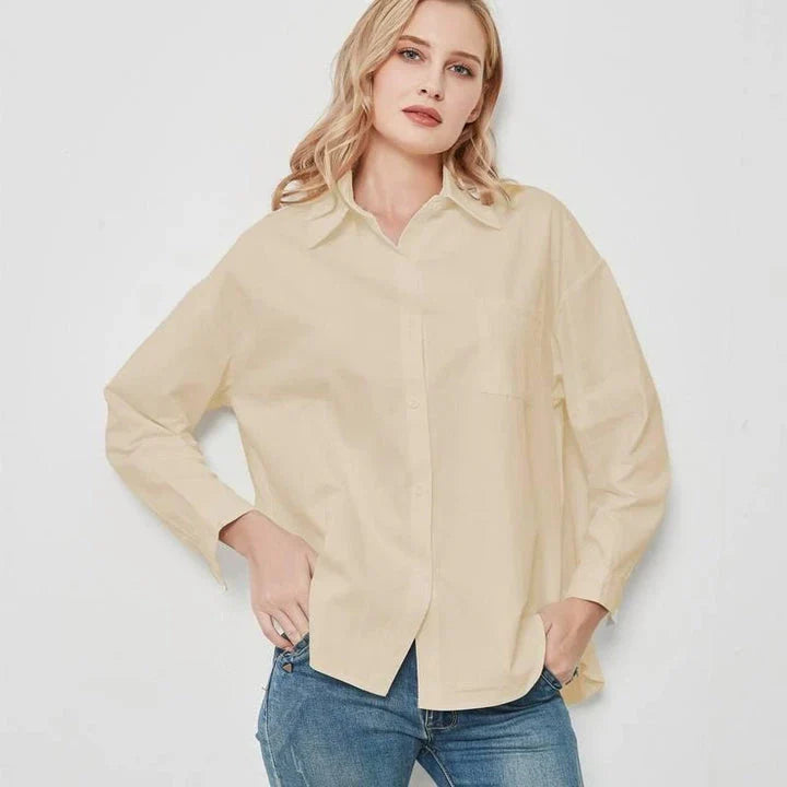 Elegant vintage-inspired blue oversize blouse with a sophisticated turn-down collar and full-length sleeves