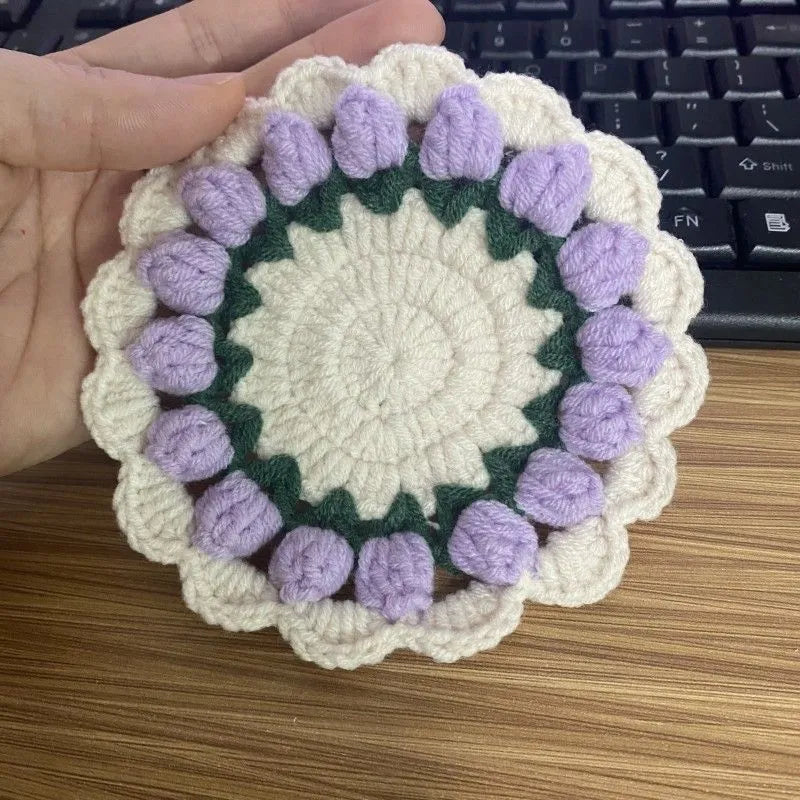Handmade cotton and linen woven flower coaster plate protector set in four floral colours pink purple red yellow for decorative home table top mats to absorb condensation from drinks