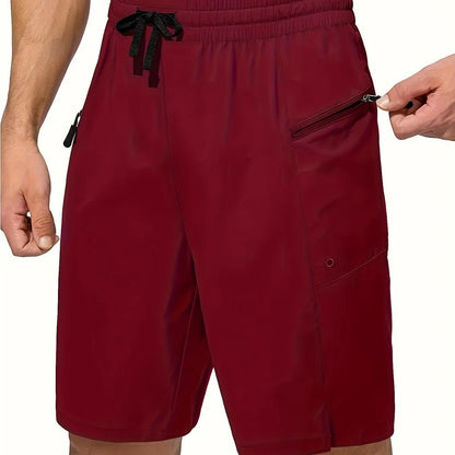 Man wearing solid colour straight-leg beach shorts in quick-dry polyester fabric.