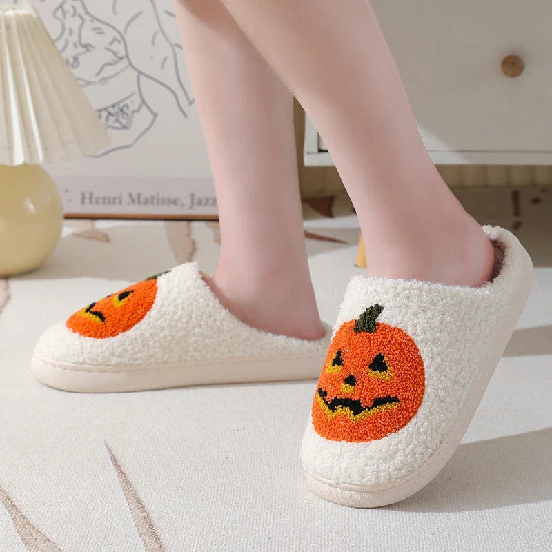 Cozy pumpkin cartoon slippers with soft suede uppers and plush cotton linings for comfortable indoor wear
