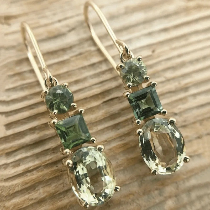 Geometric copper earrings with a retro bohemian style in a green colour, designed as quadrilateral-shaped fashion accessories suitable for unisex wear, offering an all-match aesthetic for everyday outfits.