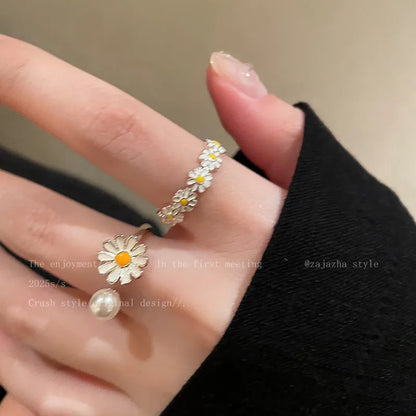 Women's copper opening sweet twin ring set showing little daisy pearl and little daisy ring designs