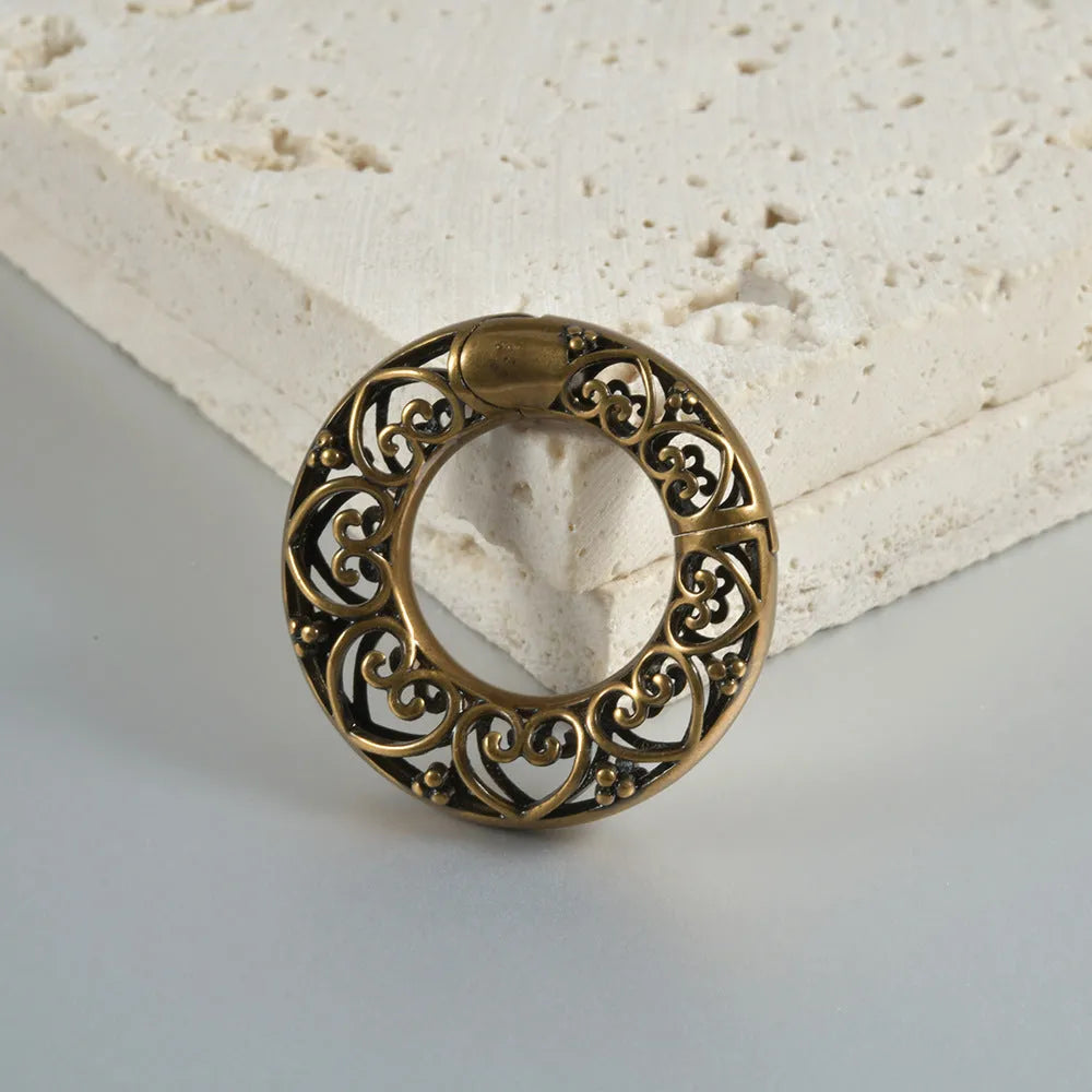 Stainless steel magnetic earrings with hollow heart or lotus design in antique silver or gold finish