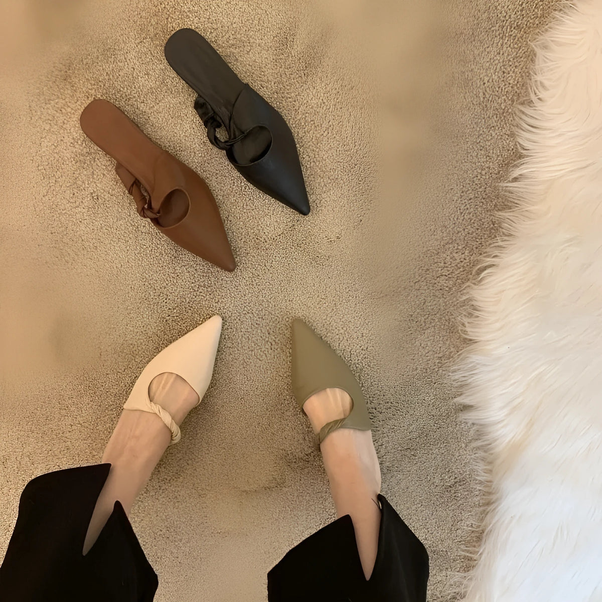 Women's soft leather-lined semi-toe box slippers in neutral colours on a rubber sole.