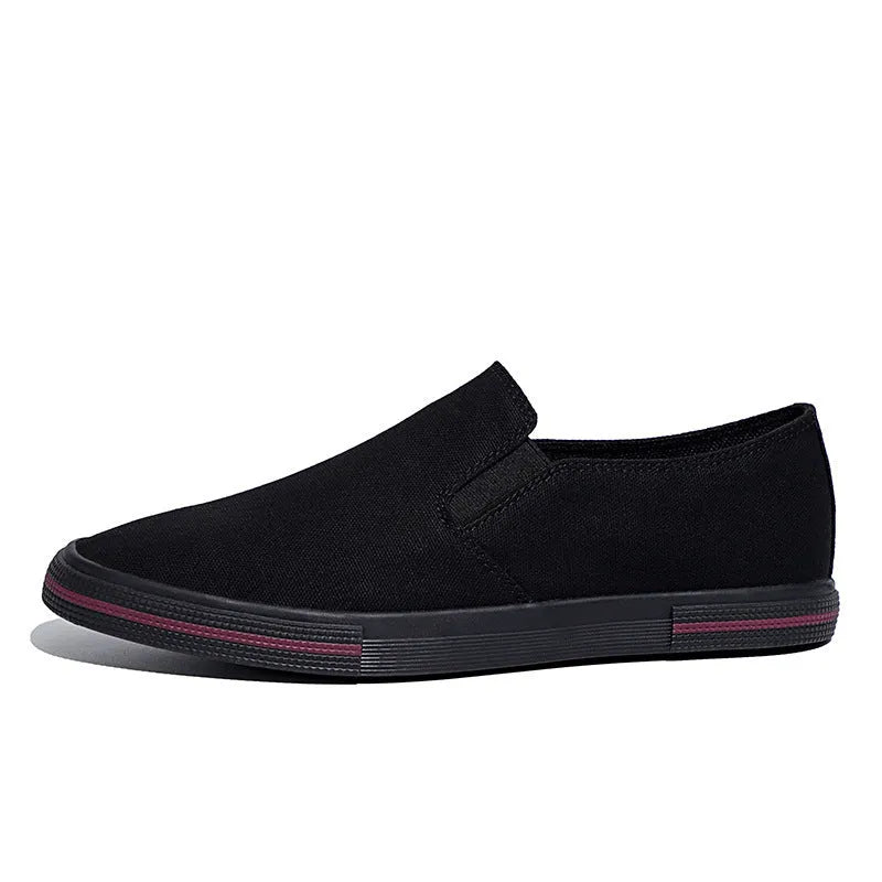 Low-top canvas slip-on sneakers with a vulcanised rubber sole in khaki colour on a neutral background.