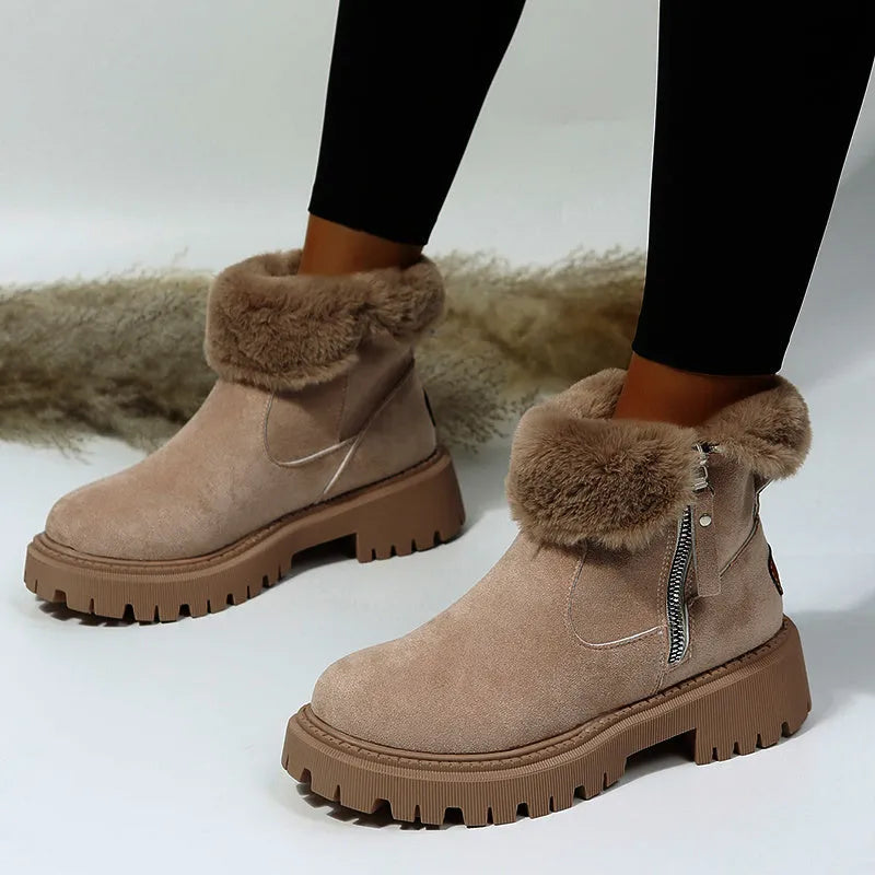 Women's black faux suede high-top snow boots with a side zipper and fur-lined collar.