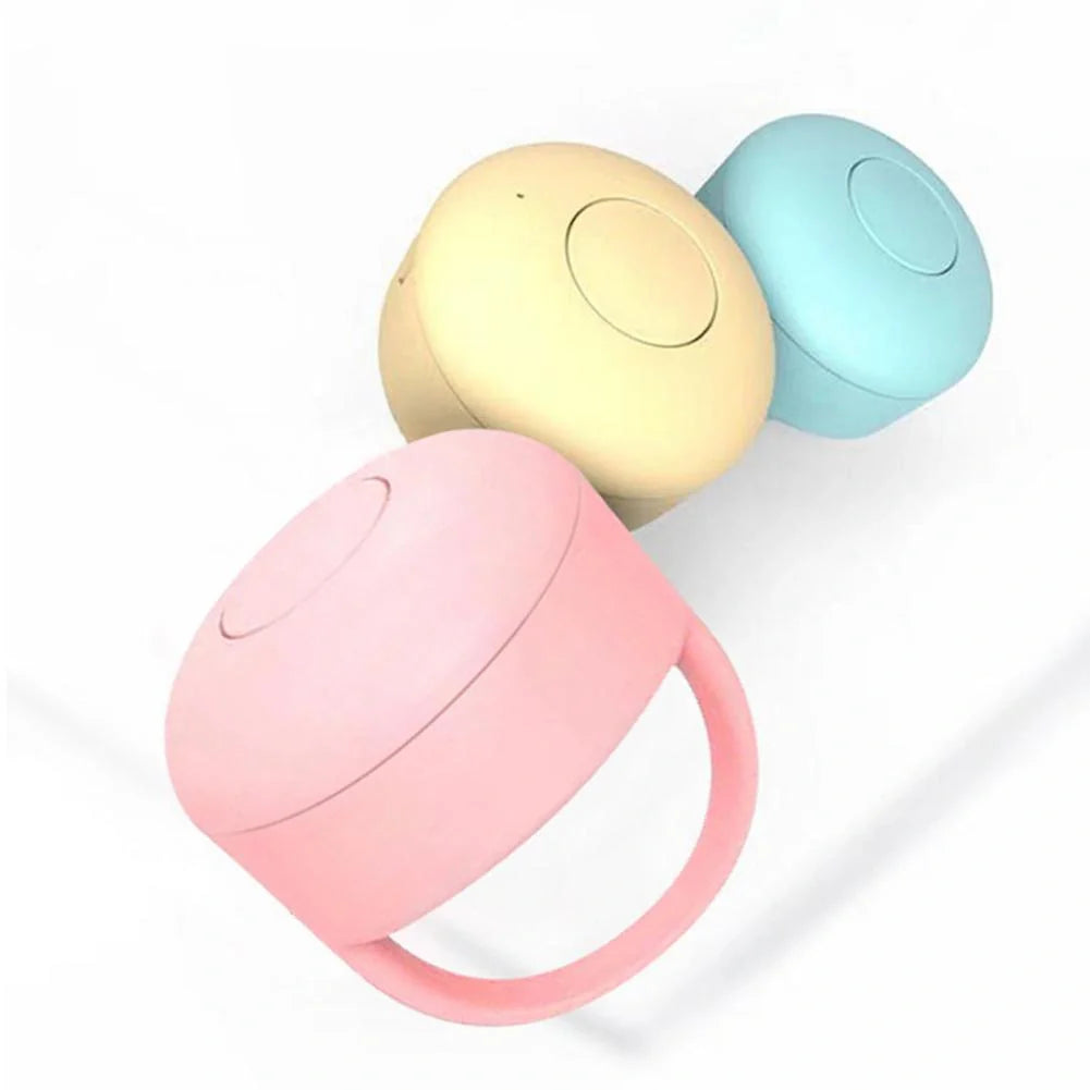 Bluetooth remote control ring for mobile phones in yellow, blue, and pink