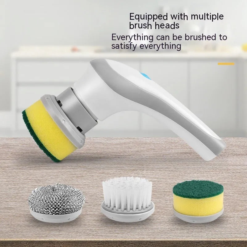 White cordless electric spin scrubber with multiple brush heads on a bathroom tile.