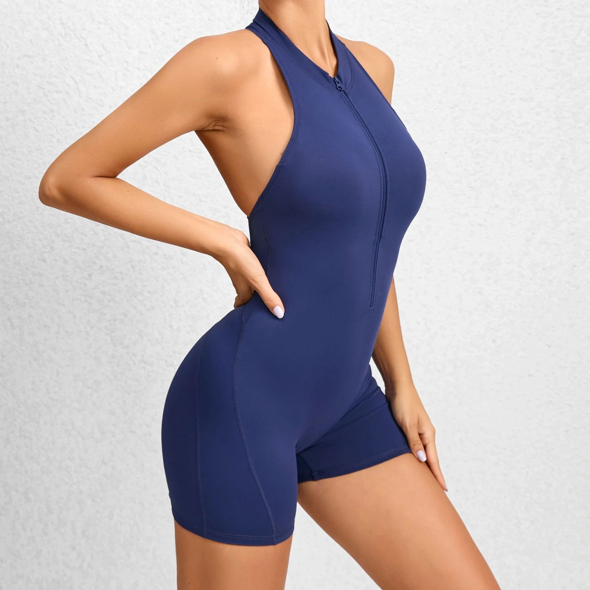 Stylish and functional zippered yoga jumpsuit with stretchy and breathable fabric, available in a variety of vibrant colors