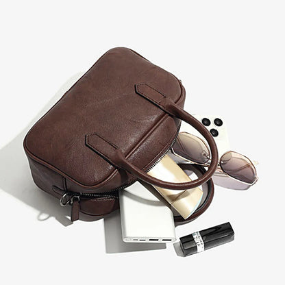 Small square retro messenger bag with single shoulder strap in black or coffee colour