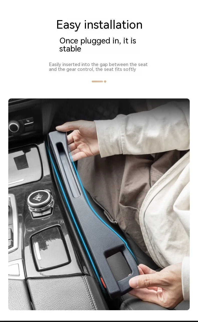 Black car seat gap storage box organiser with compartments and carrying handle between vehicle seats