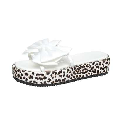 Women's leopard print thick sole beach slippers with round toe and PU upper in black and white options