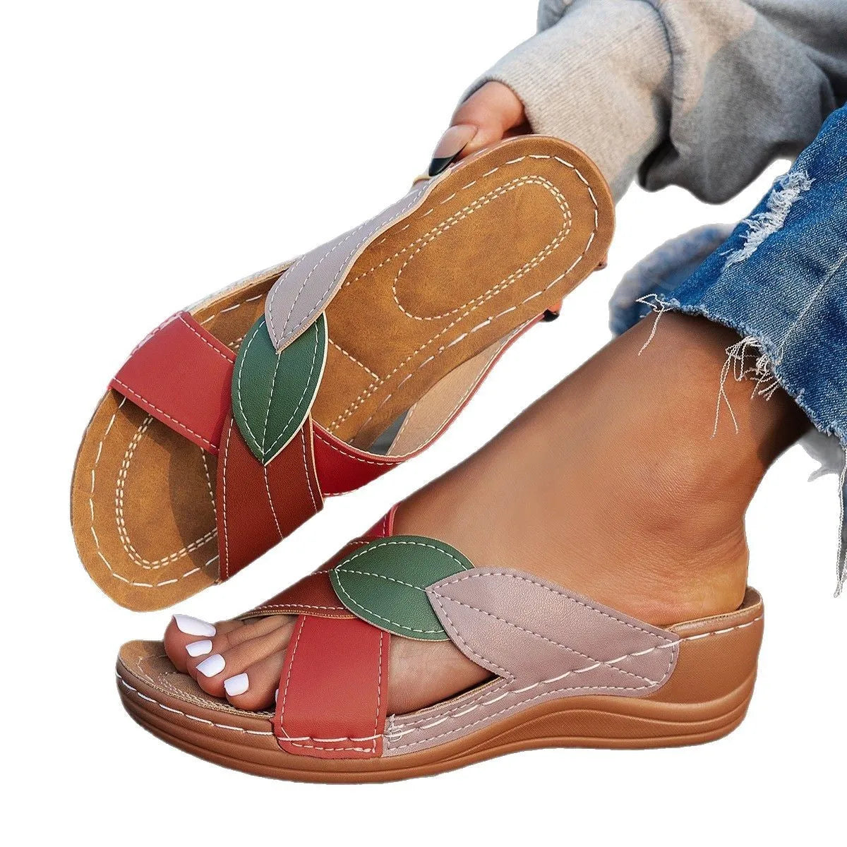 Women's black thick-soled cross-strap peep-toe slippers on a white background.