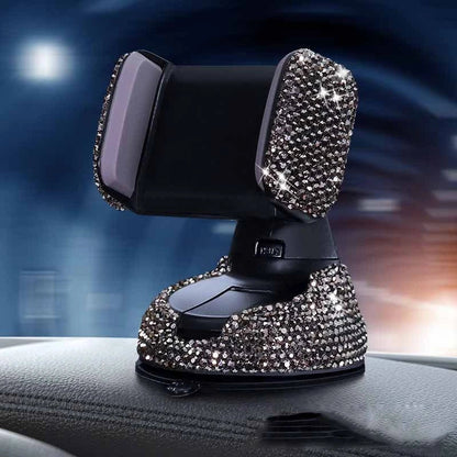 Diamond-encrusted car phone holder mounted on air vent with smartphone securely attached