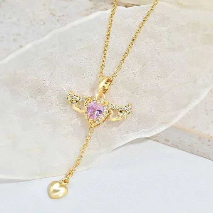 Elegant angel wings necklace with moving heart pendant, made of titanium steel and crystal accents
