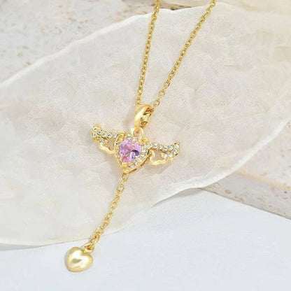 Elegant angel wings necklace with moving heart pendant, made of titanium steel and crystal accents