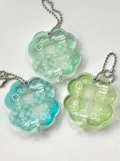 Four-leaf clover shaped acrylic phone pendant keychain in blue, green, and mint colour options