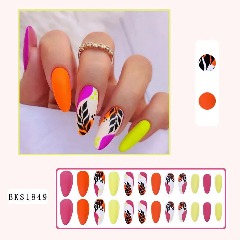 Wear Armour medium almond frosted nail stickers showing four designer patterns including French leaves and leopard print