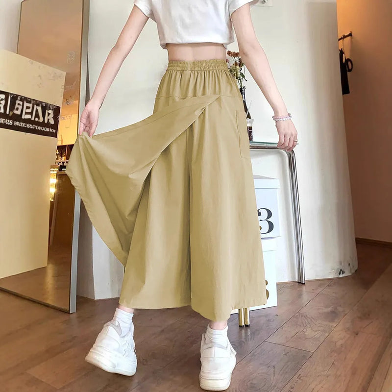 Women's casual skirt with wide leg and cropped length in camel colour, made from 100% polyester fabric with drape detailing, featuring elastic waist and micro elasticity for comfort, suitable for Japanese Korean fashion styles and everyday wear