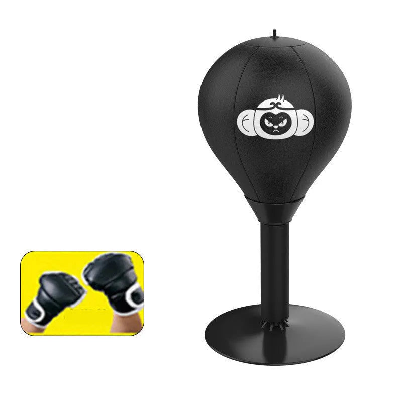 Tabletop boxing speed ball with suction cup base on a desk, showing burst bear design and flexible connection tube