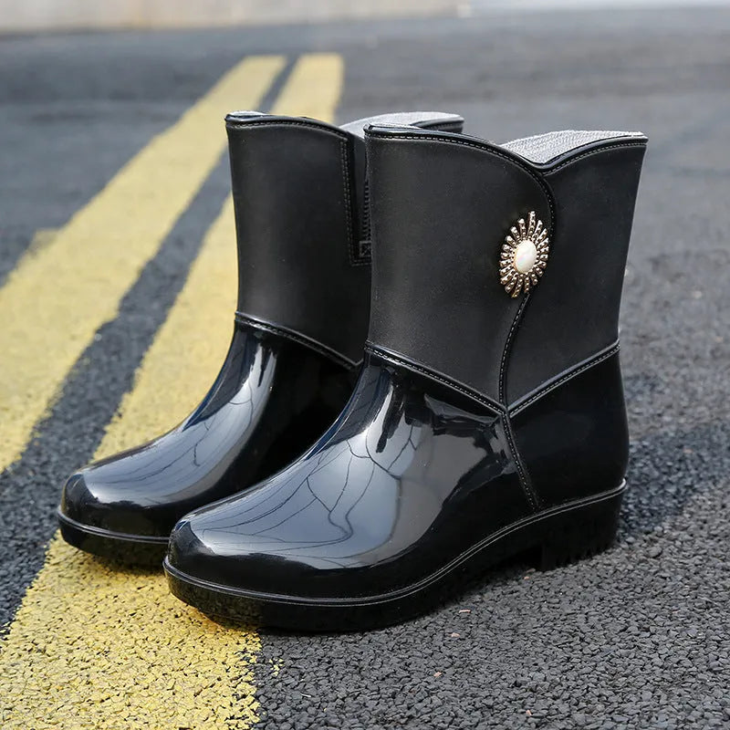 Women's mid-calf rain boots in beige, black, or purple with a non-slip sole.