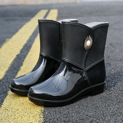 Women's mid-calf rain boots in beige, black, or purple with a non-slip sole.